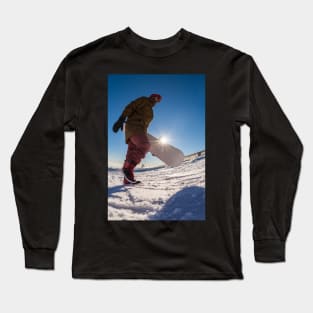 Snowboarder walking against blue sky Long Sleeve T-Shirt